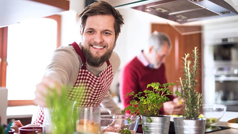 hipster son and dad cooking